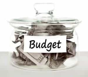 budget jar with paper bills inside