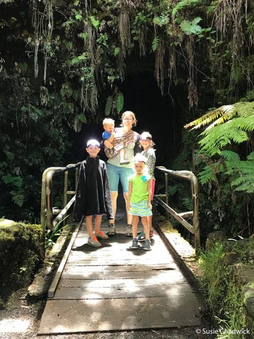 Hawaii volcano national park family entering lava tube - Big Island of Hawaii with kids.