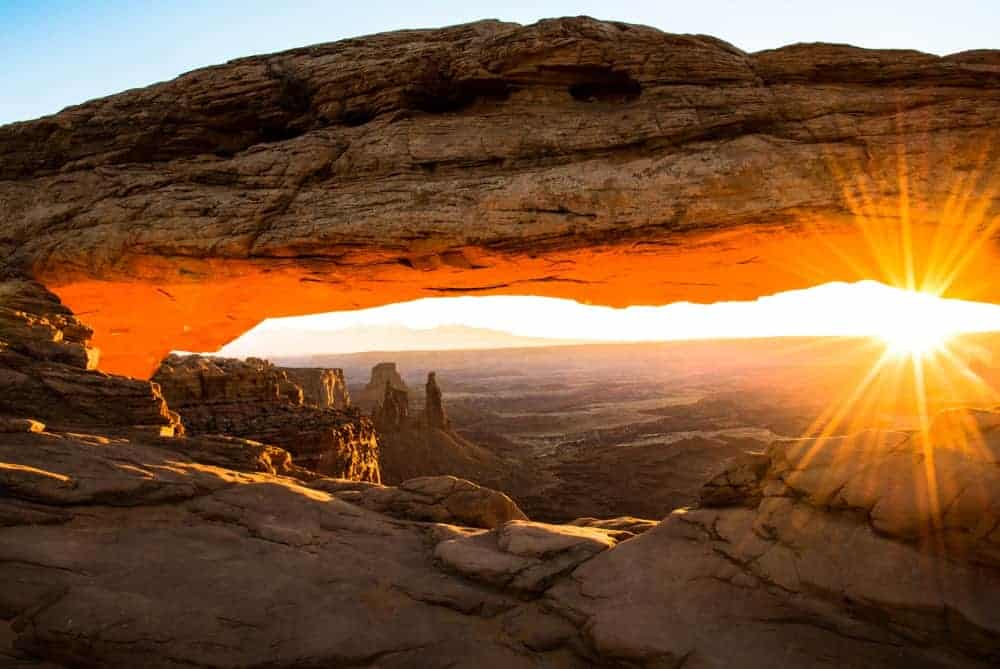 Sunrise Photography: Tips to Get Beautiful Sunrise Photos - Mesa Arch at sunrise at Canyonlands National Park, Utah