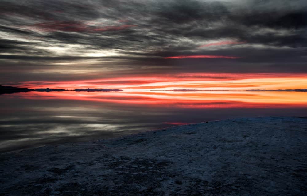 Sunrise Photography: Tips to Get Beautiful Sunrise Photos - golden sunrise at Bonneville Salt Flats, Utah