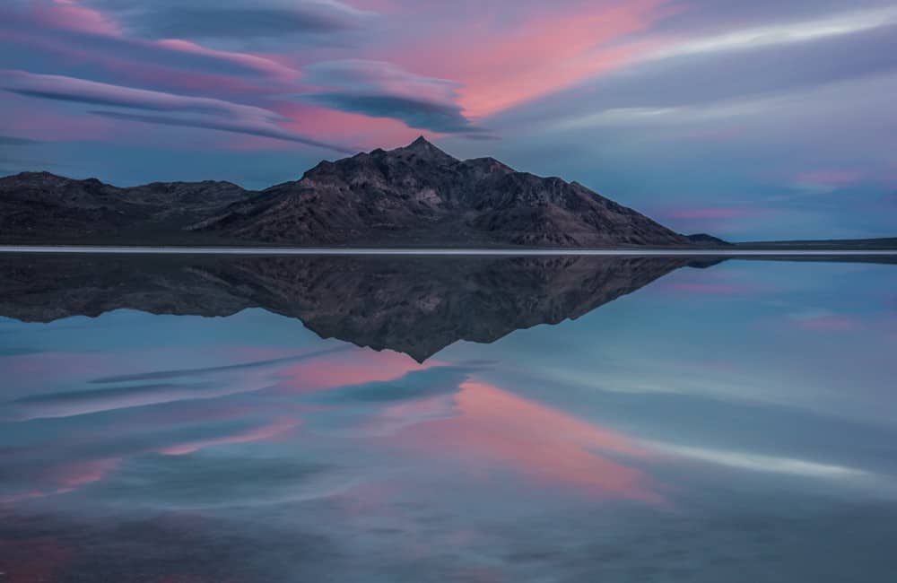 Sunrise Photography: Tips to Get Beautiful Sunrise Photos - sunrise with pink clouds at Bonneville Salt Flats in Utah