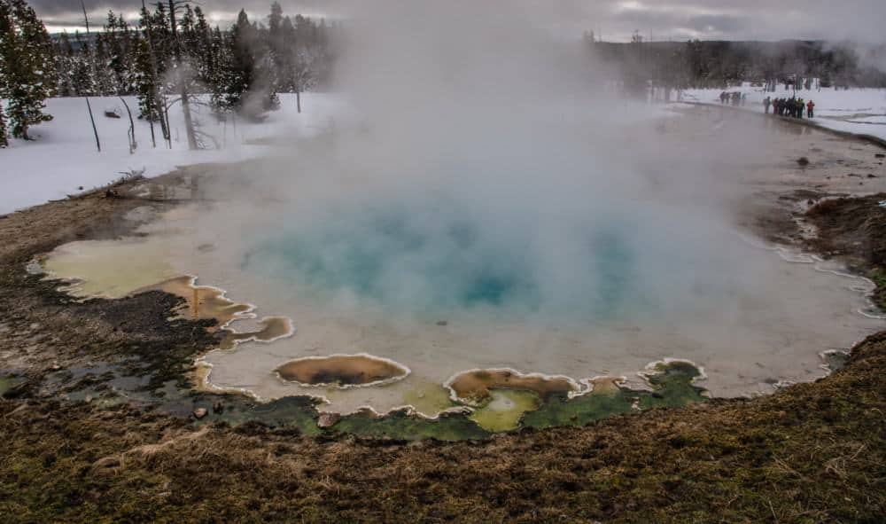 Hot pool with steam at Yellowstone in the winter
