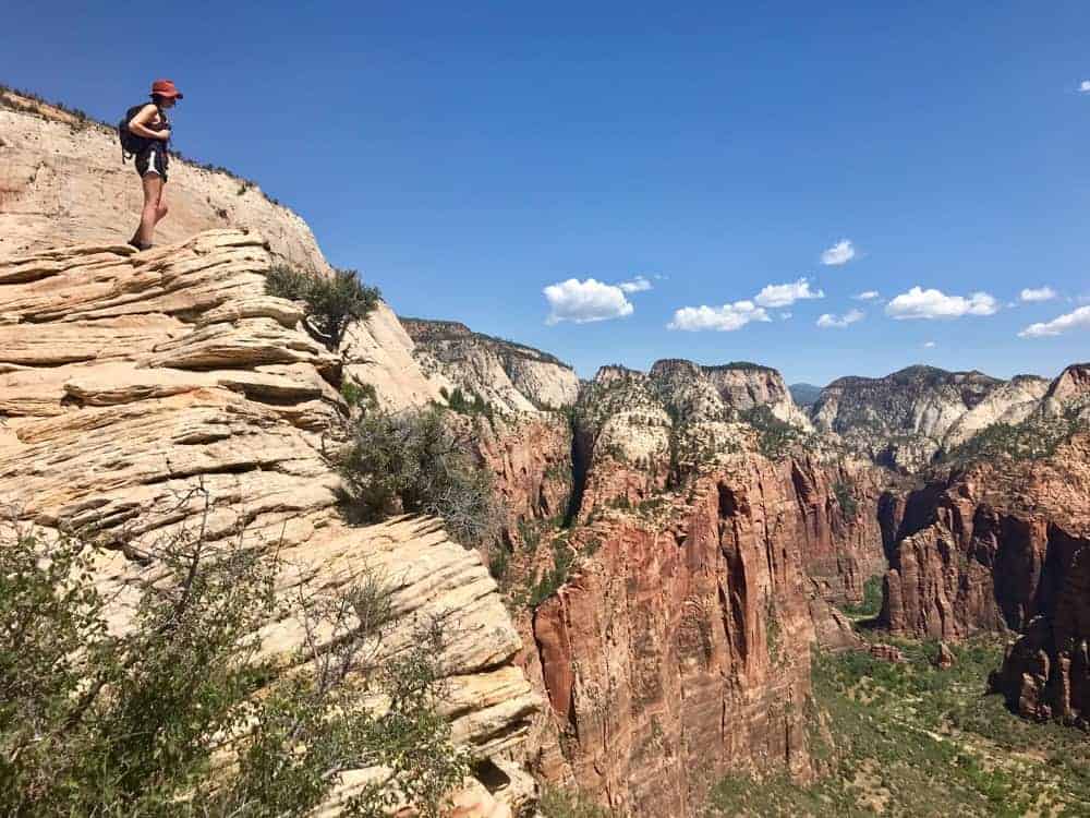 Woman hiker overlooking Zion National Park: National Parks with kids