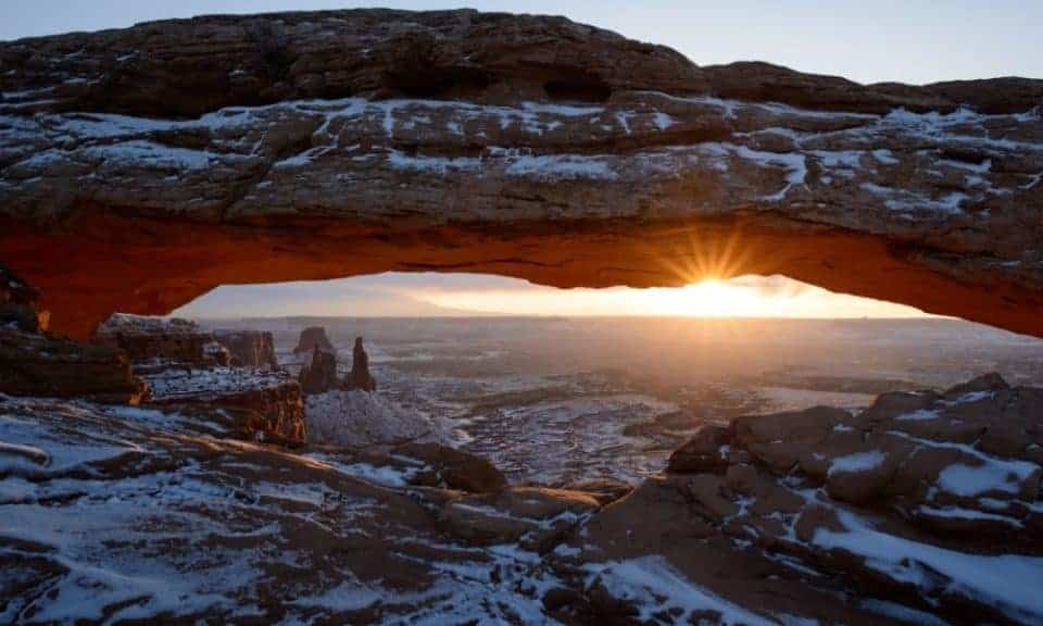 Mesa Arch at Canyonlands in the winter with snow