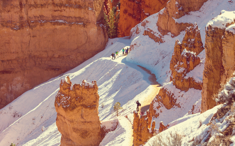 hikers on the trail to Bryce Canyon in the snow