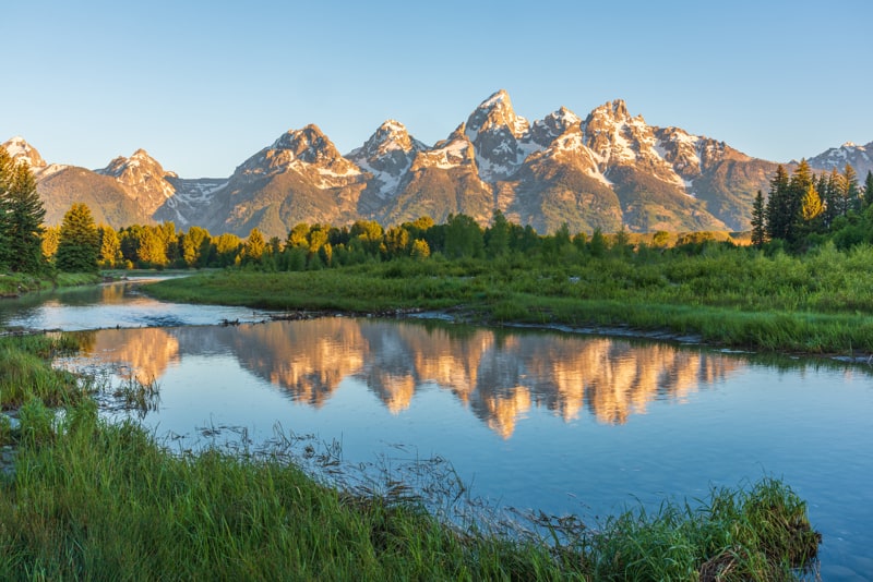 reflection of the Tetons in the Snake River at sunrise