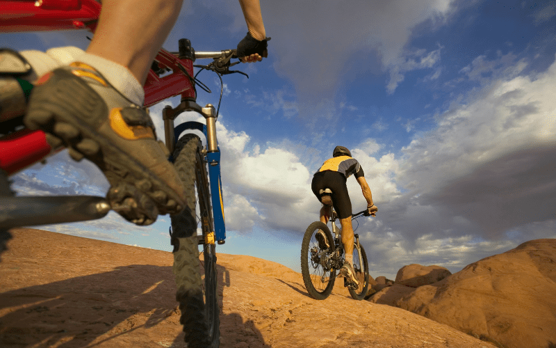 two men biking in Moab
