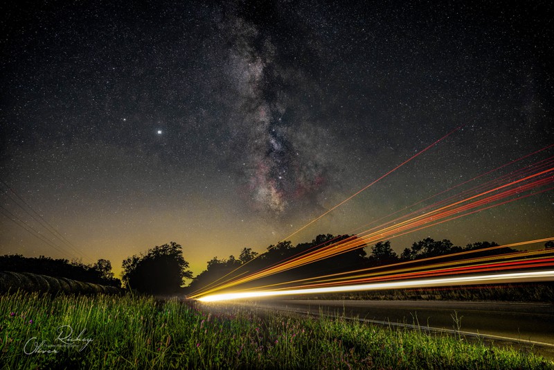 long exposure light trails and the milky way at night