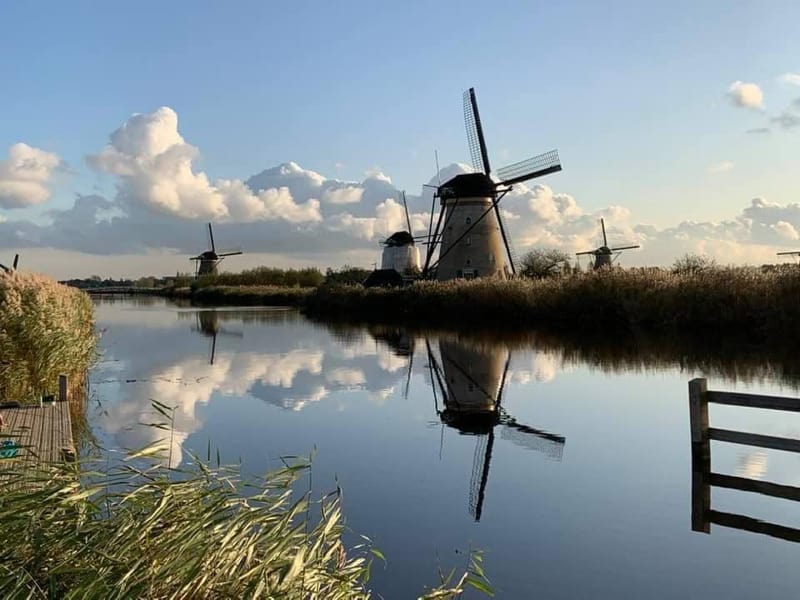 Landscape photography of windmills reflected in water