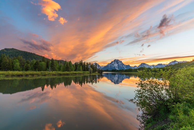 sunset colors reflected in the Snake River at Oxbow Bend