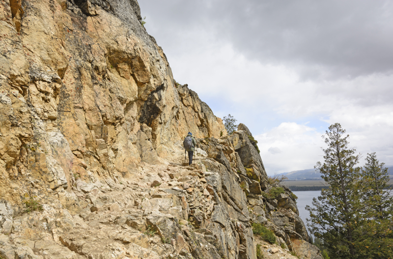 hiker on the inspiration point trail at Grand Teton