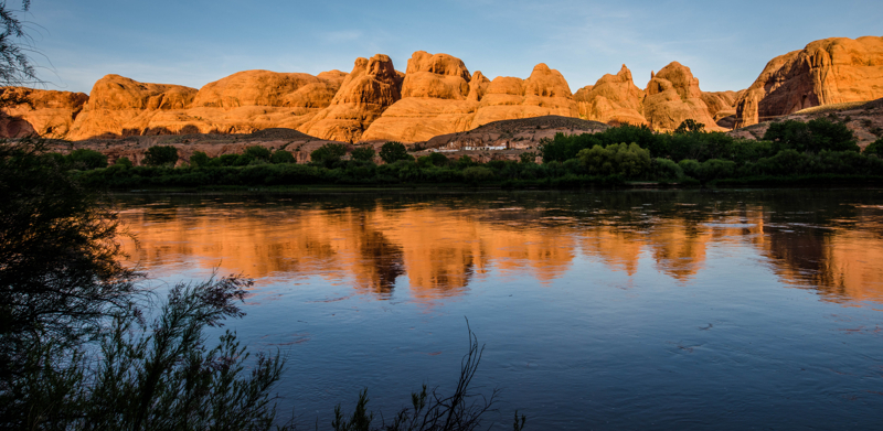 reflection of the red rocks in the Colorado River along the Potash Road
