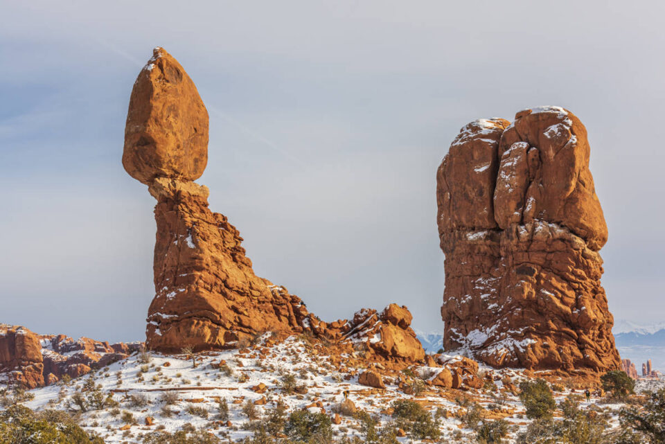 balanced rock with snow at Arches 