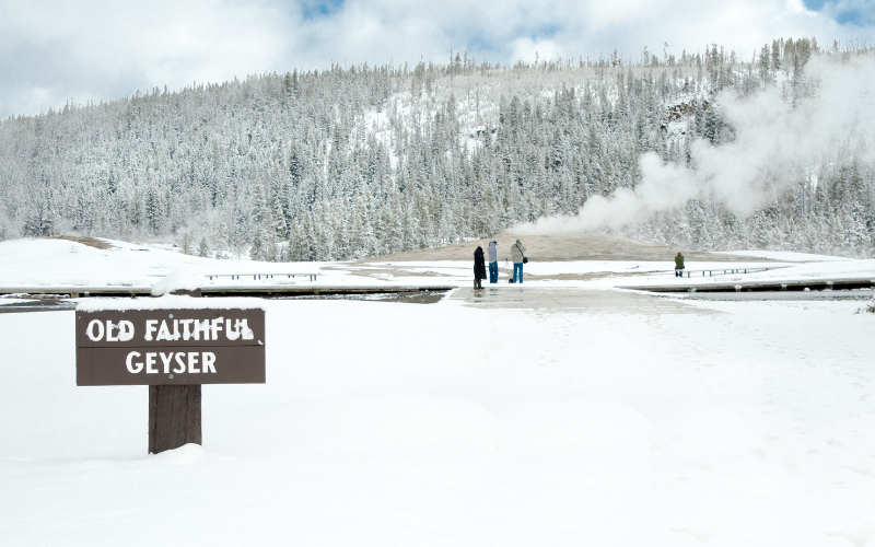 Old Faithful at Yellowstone sign in the winter