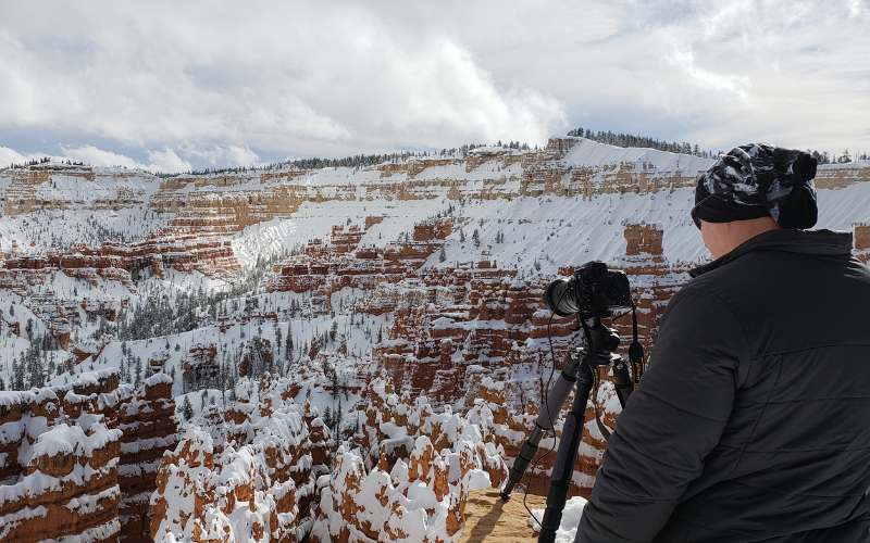 photographer at Bryce Canyon in the winter
