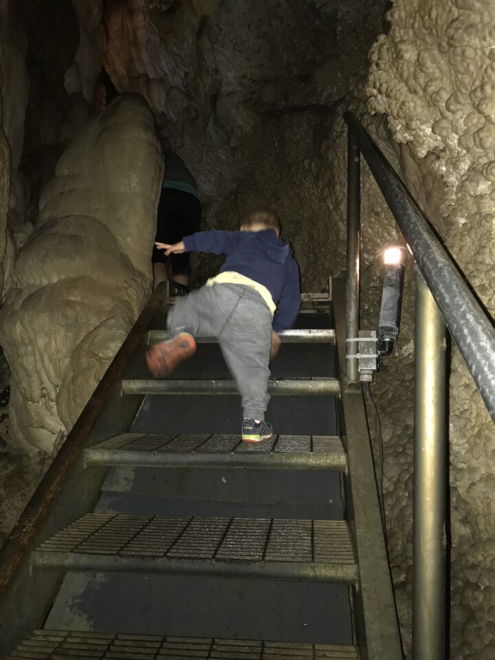 toddler climbing stairs in Timp Cave